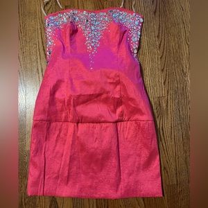Barbie pink sequined strapless dress.